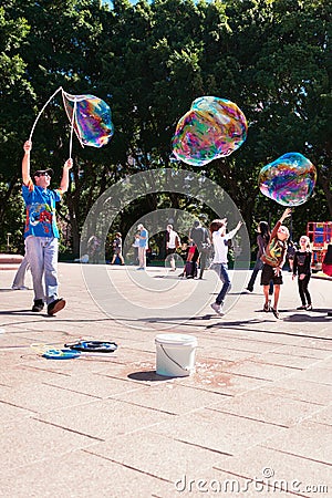 Street entertainer with giant bubbles in Sydney, Australia, April 2012 Editorial Stock Photo
