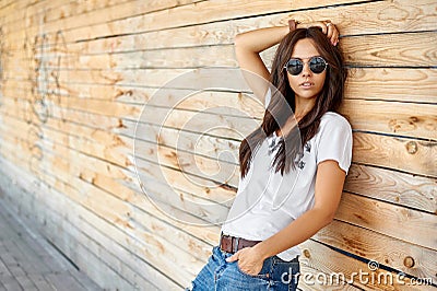 Street fashion portrait of trendy beautiful woman in sunglasses Stock Photo