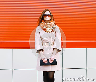 Street fashion pretty stylish woman model in coat and sunglasses Stock Photo