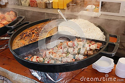 Street fast food - boiled rice, beef meat with chili pepper s Stock Photo