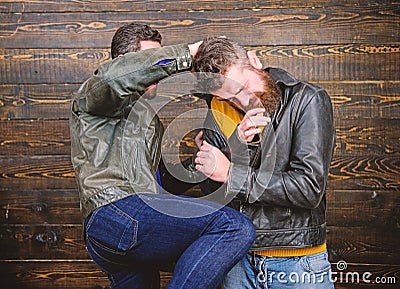 Street fight concept. Men brutal hooligans wear leather jackets fighting. Physical attack. Men bearded hipster fighting Stock Photo