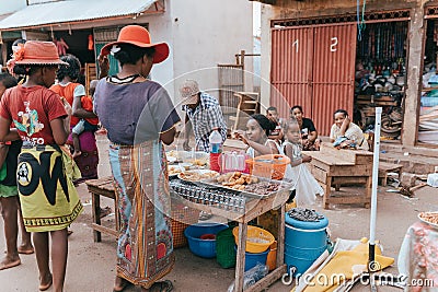Street food seller on the main street in Miandrivazo. In Madagascar, people usually eat on the street Editorial Stock Photo
