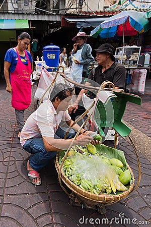 Street food vendor making mango salad in Chinatown, Bangkok, Thailand Editorial Stock Photo