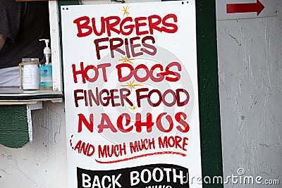 street food vendor sign for burgers, fries, hot dogs, nachos Editorial Stock Photo