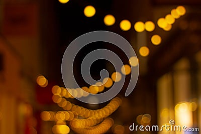 street garland light in night city, defocus, festive background Stock Photo