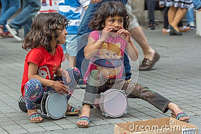 Street girls playing tambourines Editorial Stock Photo