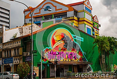 On the street. Home graffiti drawing ducane birds. Road in Kuching. Sarawak. Borneo Editorial Stock Photo