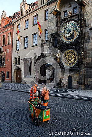 Street janitors on shift near Astronomic clock tower Editorial Stock Photo