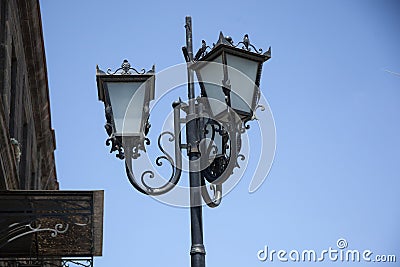 Street lamp against a cloudy sky. Stock Photo