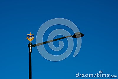 Street lamp with the symbol of Lisbon. The ship with two ravens Stock Photo