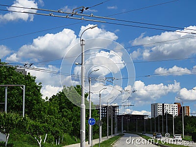 Street lamps and trolleybus electricity power grid supply. City town urban landscape. Stock Photo