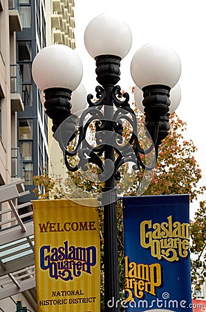 Street lamps and welcome signs in Gaslamp quarter Editorial Stock Photo