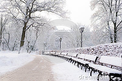 Street lantern with bench in snow beautiful cold winter day Stock Photo