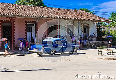 Street life view with a blue american classic car in Santa Clara Editorial Stock Photo