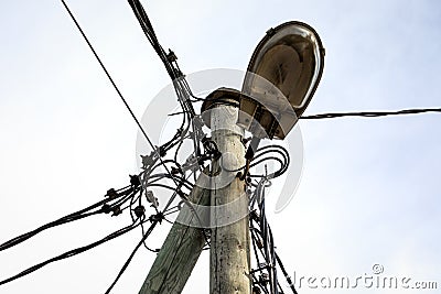 Street lighting on a pole. Electrical wires, cables and communications Stock Photo