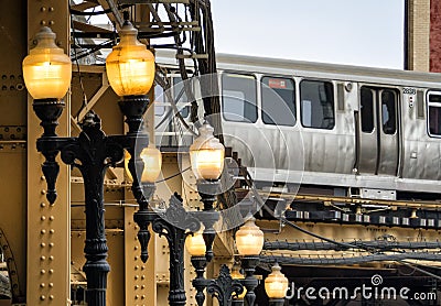 Street Lights and Train on elevated tracks within buildings at the Loop, Chicago City Editorial Stock Photo