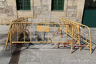 Street metal barriers around the hole Stock Photo