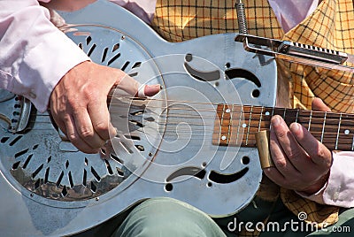 Street musician playing a dobro guitar Stock Photo