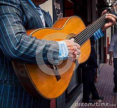 Street musician playing guitar Editorial Stock Photo