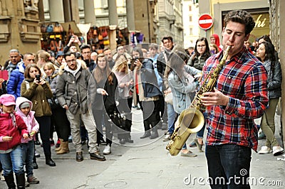 Street musician playing the sax in Florence , Italy Editorial Stock Photo