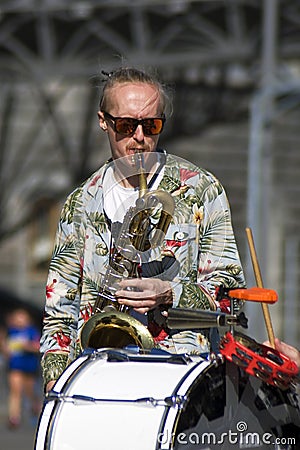 Street musician plays music. Color photo. Editorial Stock Photo