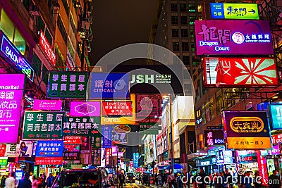 Street at night with illuminated advertisings in Hong Kong Editorial Stock Photo