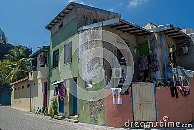 Street with old colourful house located at the Villingili island Editorial Stock Photo