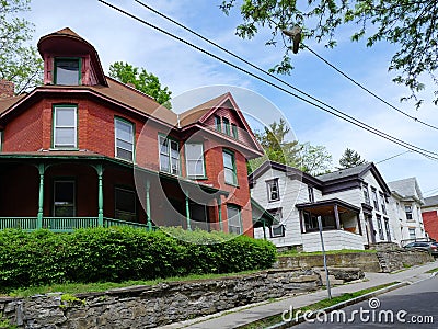 Street with old houses with large porches Stock Photo