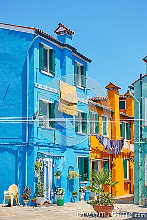Street with old multicolored houses with in Burano in Venice Stock Photo