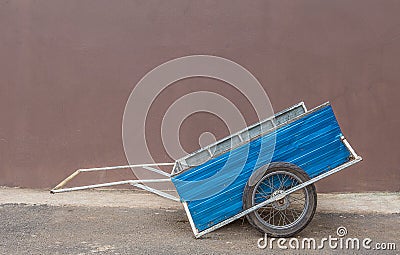 Street orange cart. Street cleaning service Stock Photo