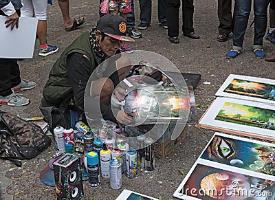 Street painter with his pictures in the pedestrian area of San Jose, Costa Rica Editorial Stock Photo
