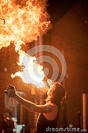 Street performer breathing fire at the annual Do West Fest on Dundas Street Editorial Stock Photo