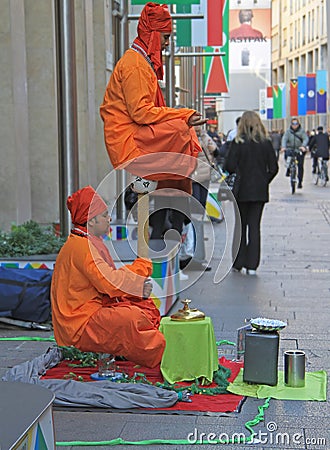 Street performers are showing a magical trick Editorial Stock Photo