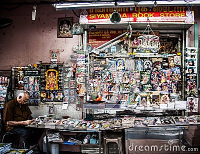 Street Photography of Elderly Man at His Roadside Magazine Shop in Singapore Editorial Stock Photo