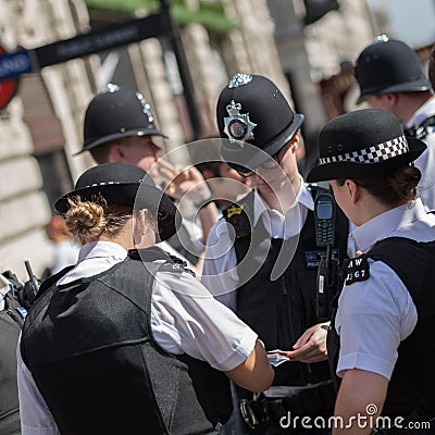 London, United Kingdom- June 2019: Street Photography: Group of London Policemen with Their Uniform Editorial Stock Photo