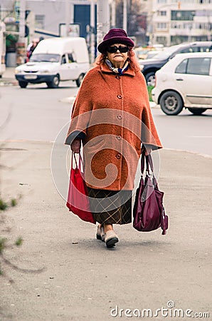 Senior Woman Carrying Shopping Bags Editorial Stock Photo