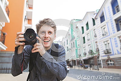 portrait of a smiling photographer in the background of the town Stock Photo