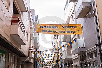 Street in Povoa de Varzim, Portugal decorated with banners and pennants to celebrate Sao Pedro festival Editorial Stock Photo