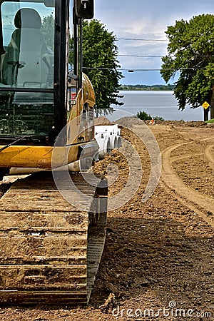 Street repair with an excavator Stock Photo