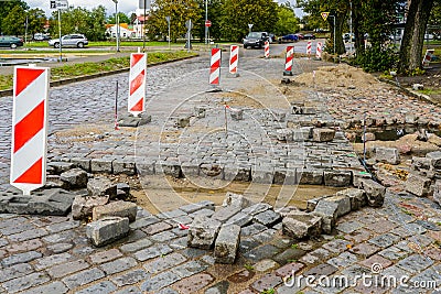 Leveling of historical granite pavement on city street Stock Photo