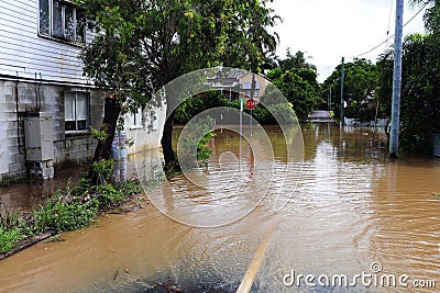 Street in a residential area submerged in floodwater in Maryborough, Queensland, Australia Stock Photo