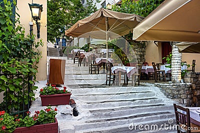Street restaurant or cafe at Acropolis foot in Plaka district, Athens, Greece Stock Photo
