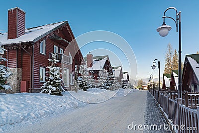 Street with row of winter chalet on the ski resort Stock Photo