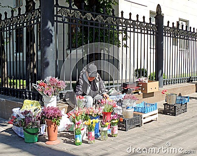 Street saleswoman of flowers Editorial Stock Photo