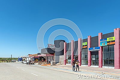 Street scene, with businesses, people and vehicles, in Groblershoop Editorial Stock Photo