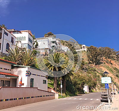 Street scene on Catalina Island with residences overlooking public showers building Stock Photo