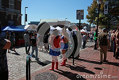 Street scene with girls in costume at the festival Editorial Stock Photo