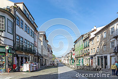 street scene in the old town of Braga with historic facades and people in early morning Editorial Stock Photo