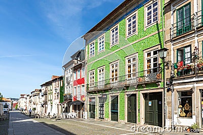 street scene in the old town of Braga with historic facades and people in early morning Editorial Stock Photo