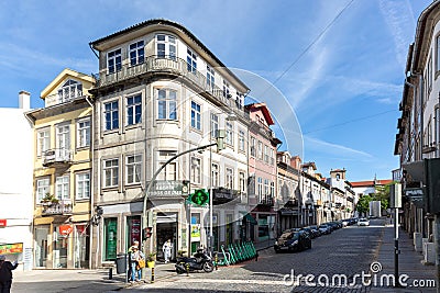 street scene in the old town of Braga with historic facades and people in early morning Editorial Stock Photo